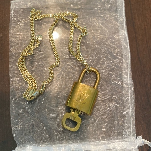 Louis Vuitton Jewelry - Louis Vuitton lock #300 with key and 16-19” chain